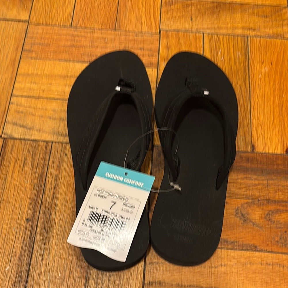 Reef Black Flip Flops with Comfort Tag
